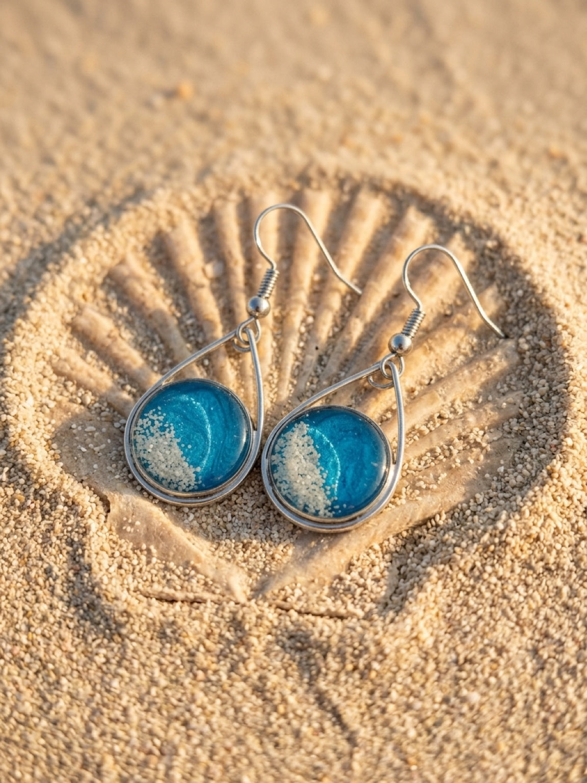 Silvertone Cayman sand teardrop earrings
