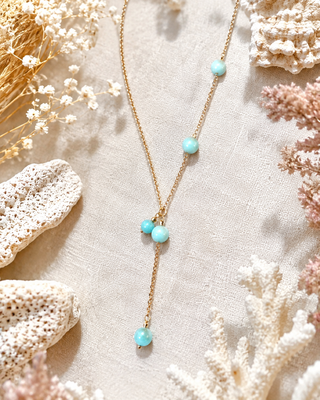 Amazonite bead lariat necklace on light fabric