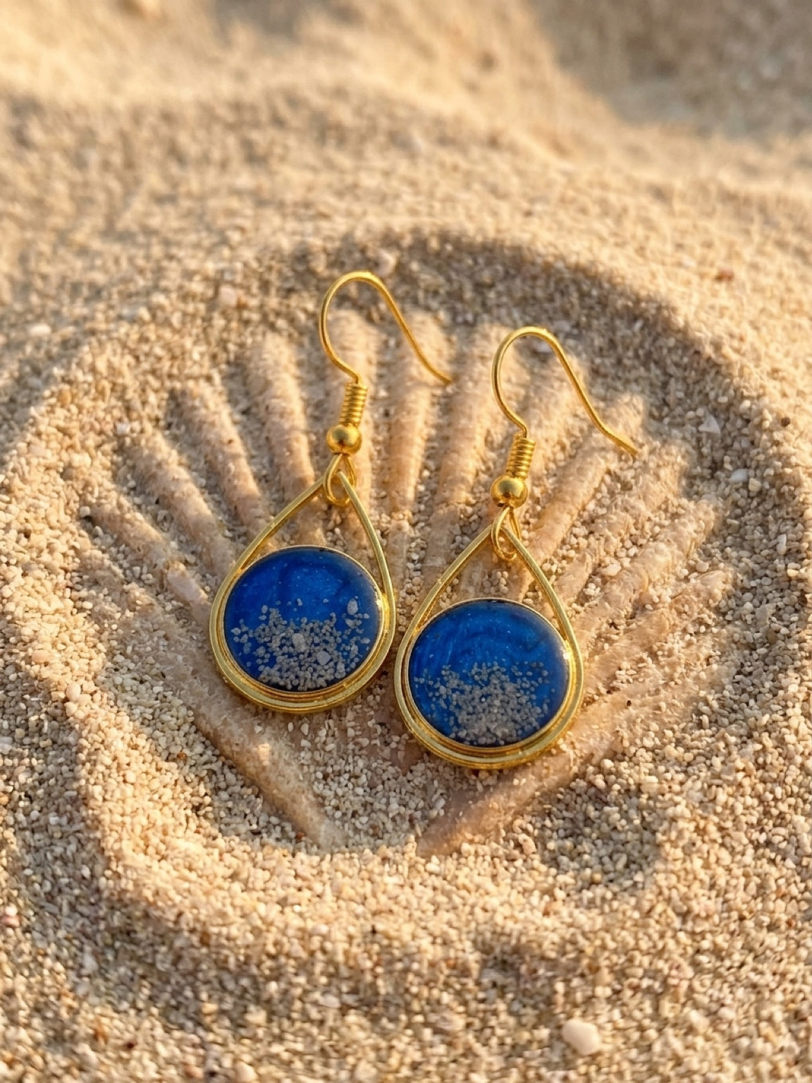 Goldtone Cayman sand teardrop earrings