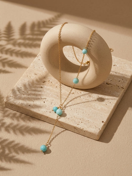 Amazonite bead lariat necklace on warm stone display