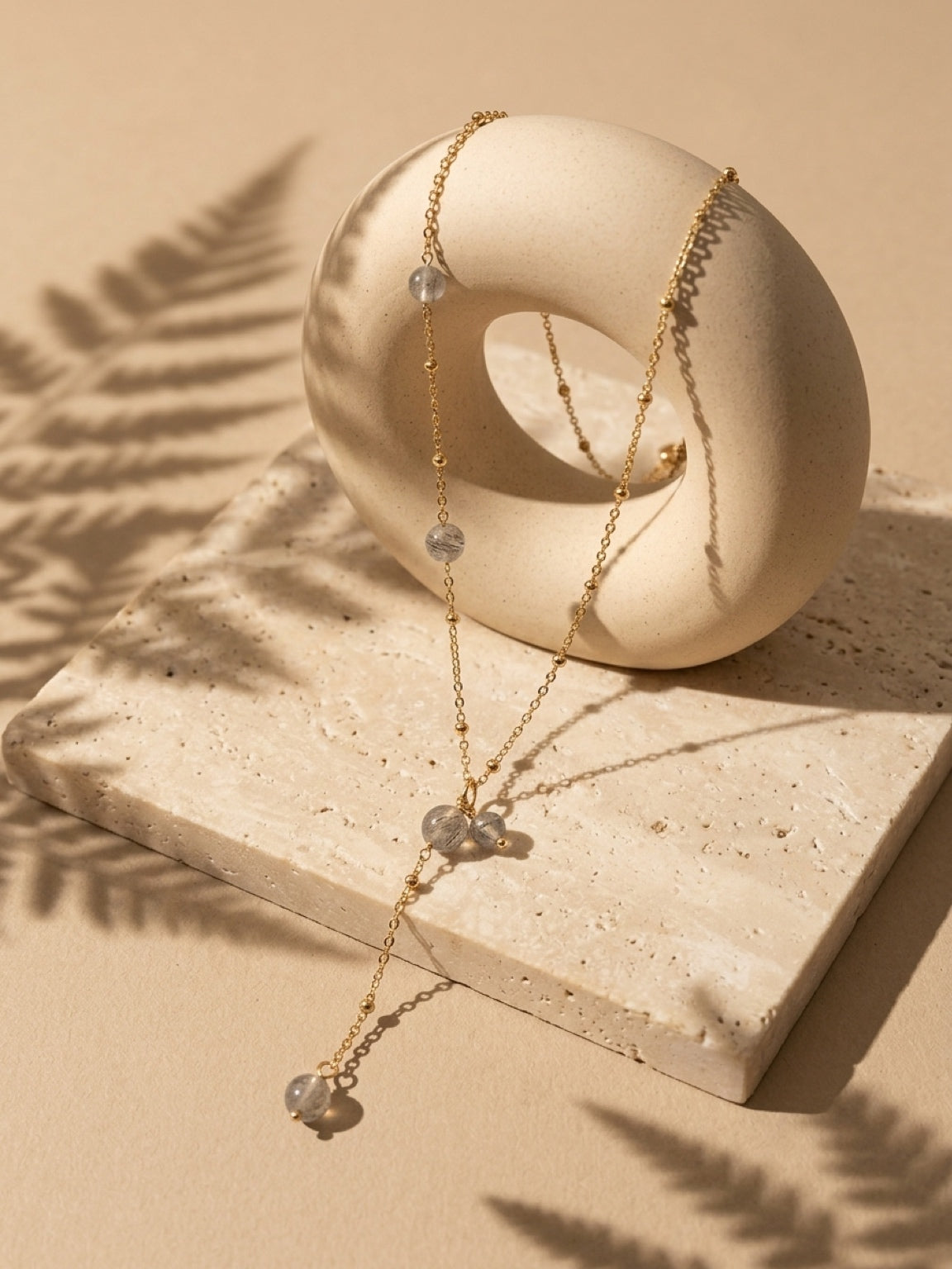 Labradorite bead drop necklace on a gold tone chain